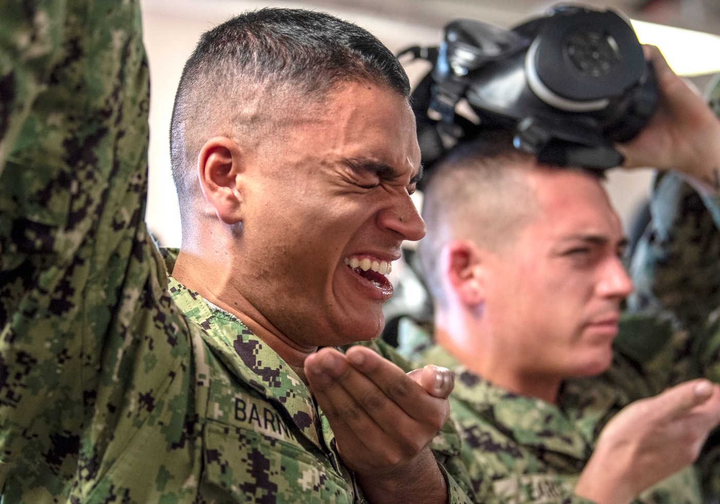 In this photograph, these navy recruits undergo mental toughness training.