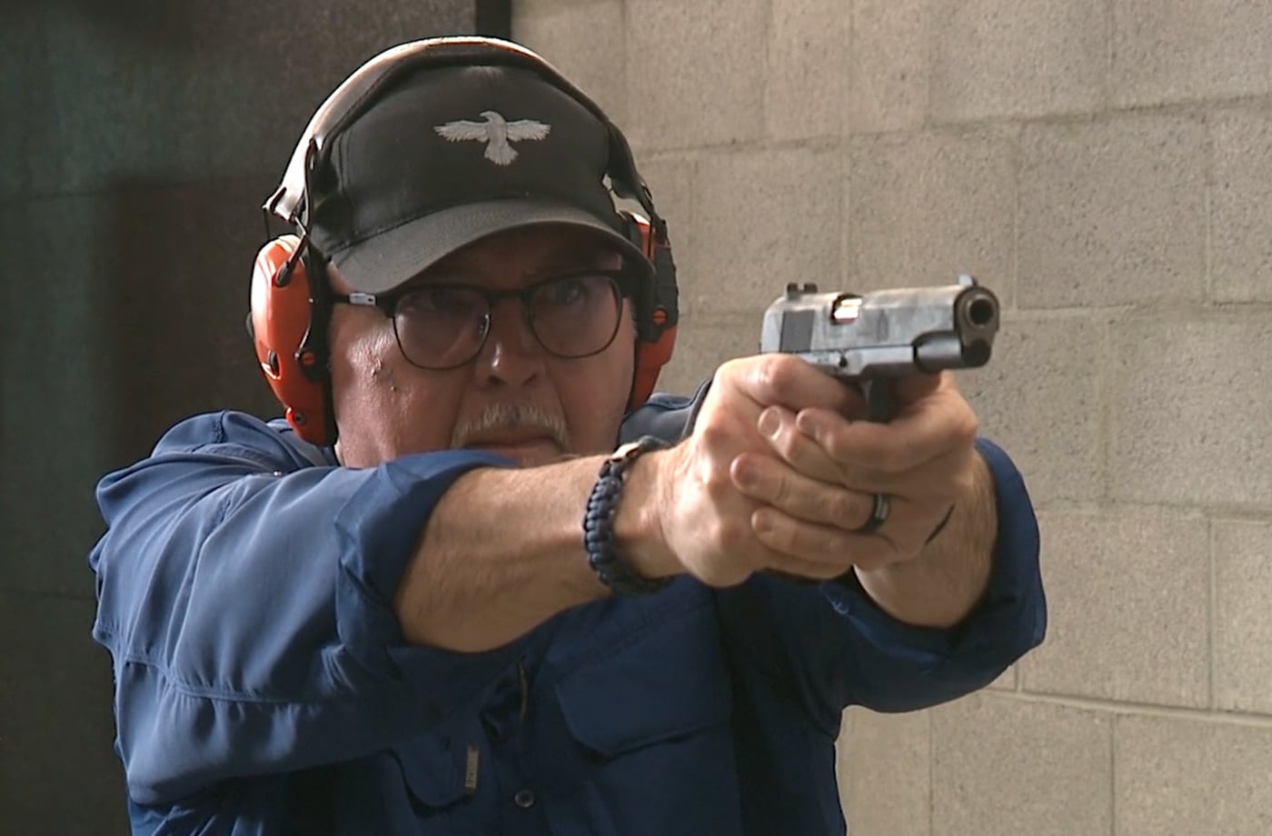 Yamil Sued shooting Defender Series 1911 at indoor range