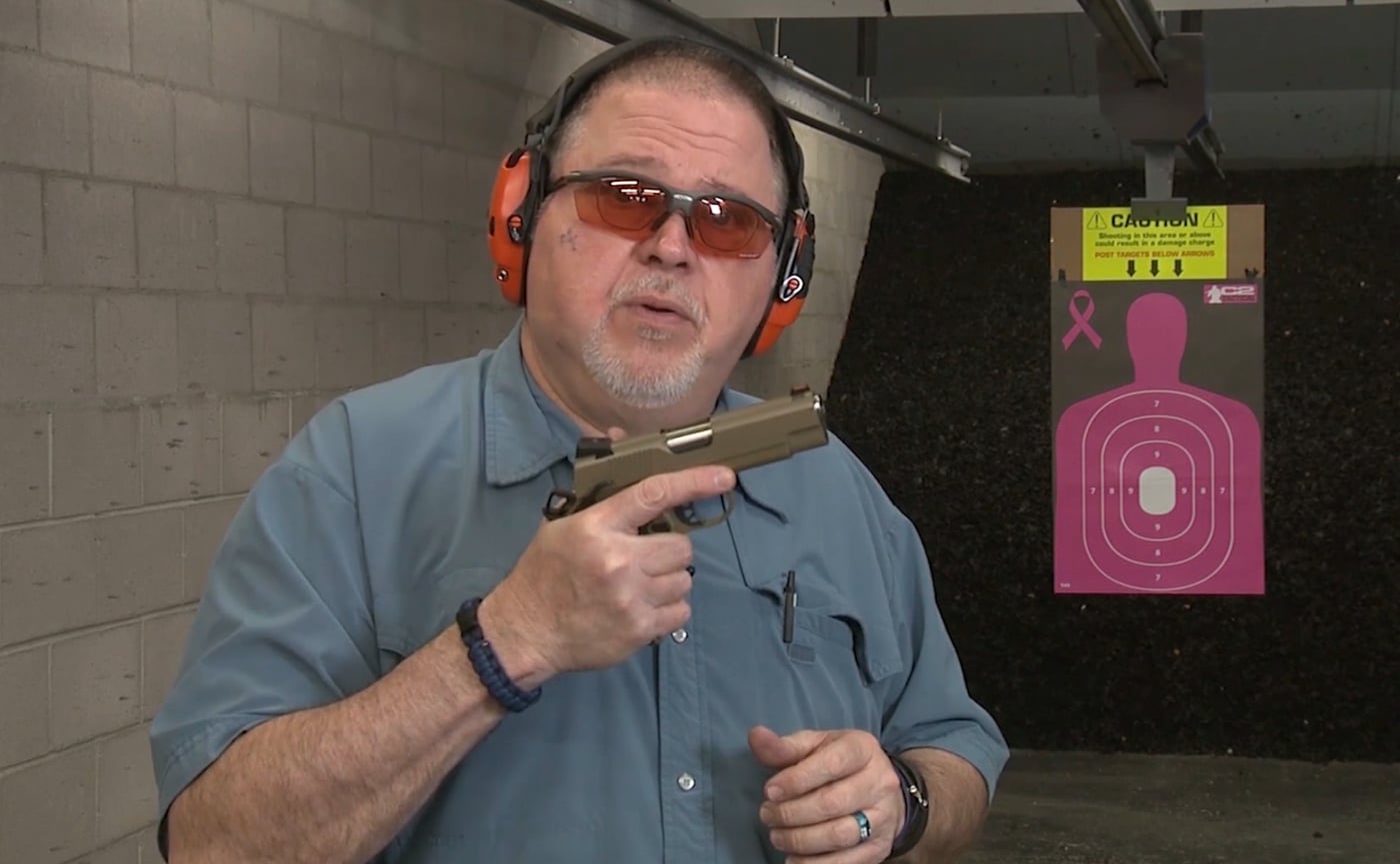 A shooter's hand firmly grips the EMP4, demonstrating how the compact frame and reduced circumference allow proper finger placement and natural hand position. The EMP4 ergonomics accommodate smaller hand sizes effectively. Springfield Armory EMP4 features scaled-down grip dimensions. Compact 1911 pistols provide superior hand fit compared to full-size variants. The EMP4 bobbed tail prevents grip discomfort. Reduced-frame firearms improve shooting control for diverse shooters. Springfield's compact design includes well-fitted beavertail safety. The EMP4 grip texture enhances weapon retention.