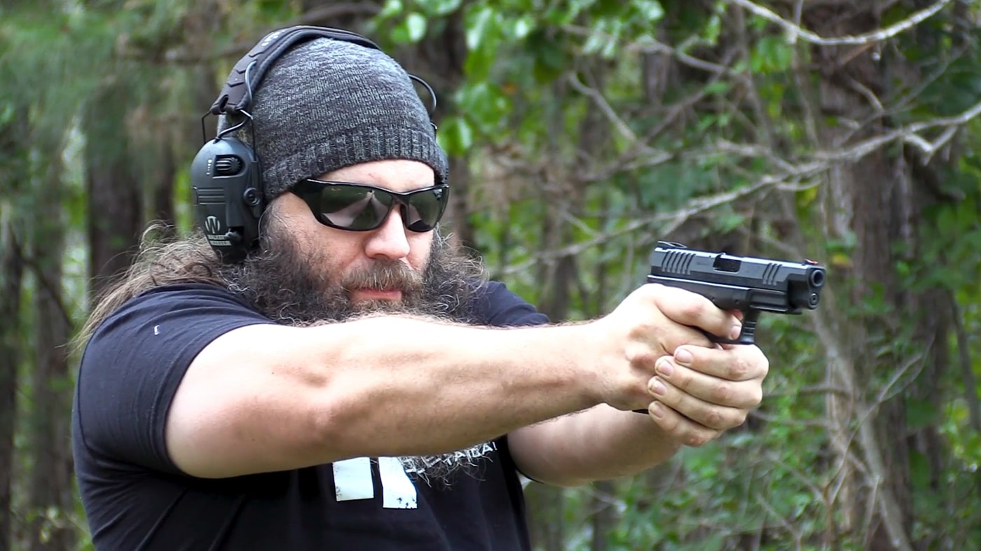 author shooting the pistol