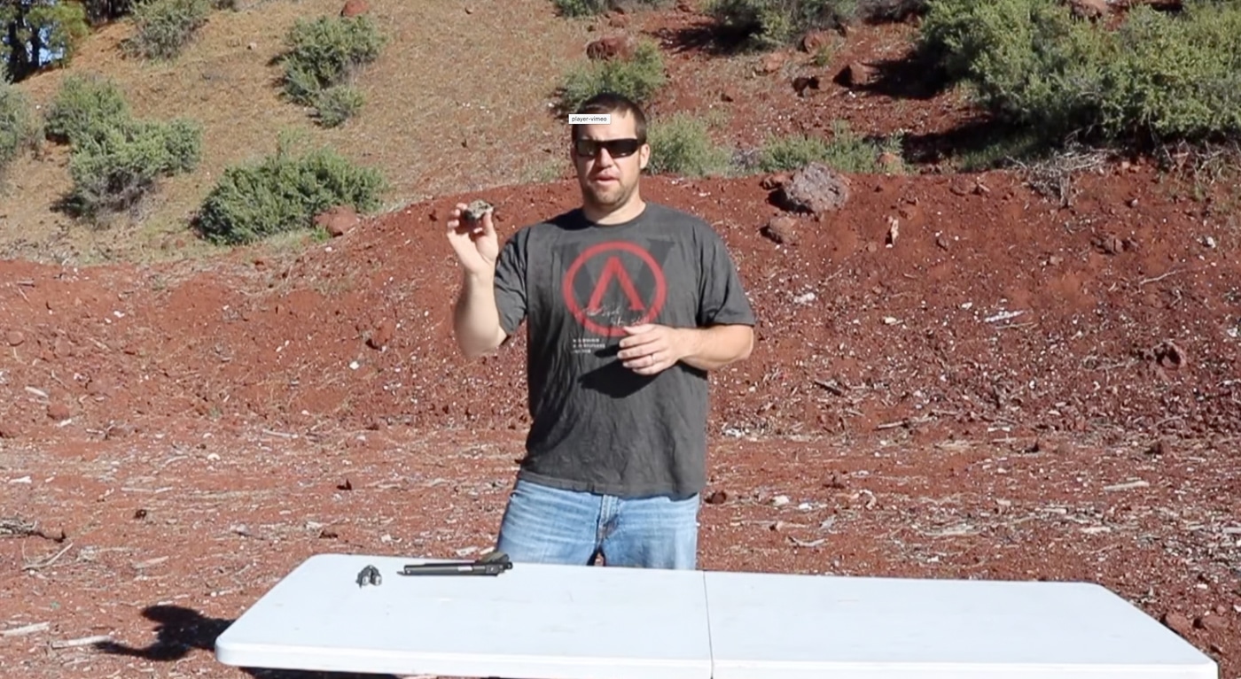 A person's hand holding the Viridian X5L light and laser unit, displaying its compact rectangular shape and control switches. The Viridian X5L review examines build quality and ergonomics. Light and laser unit design affects mounting flexibility. Green laser modules require precise construction standards. Defensive accessories must balance size with capability. The X5L features ambidextrous activation controls. Compact units maintain weapon maneuverability in confined spaces. Rail-mounted systems should not compromise grip positioning. Integrated designs combine multiple functions efficiently.