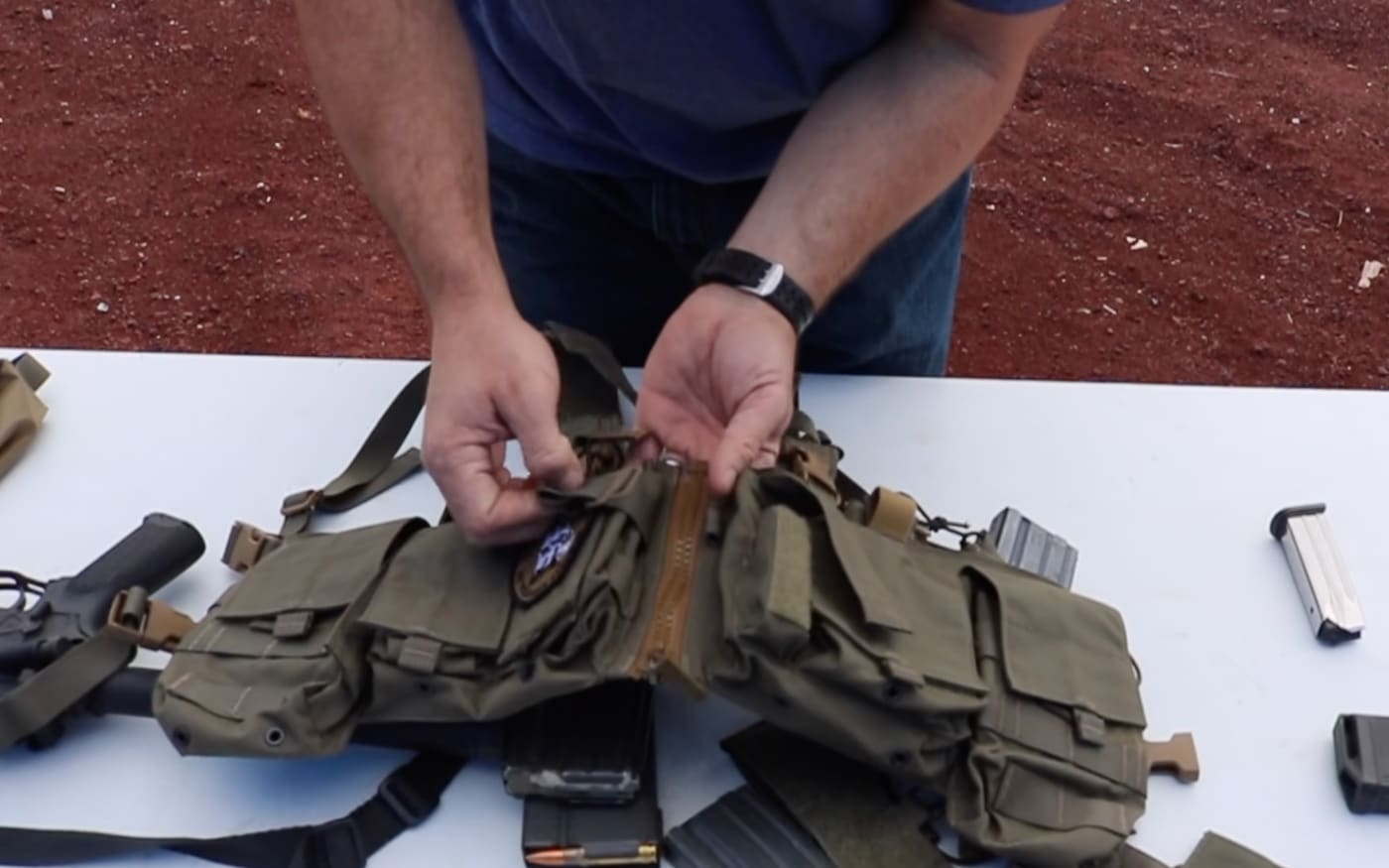 author showing the zippered split front of the Mayflower chest rig