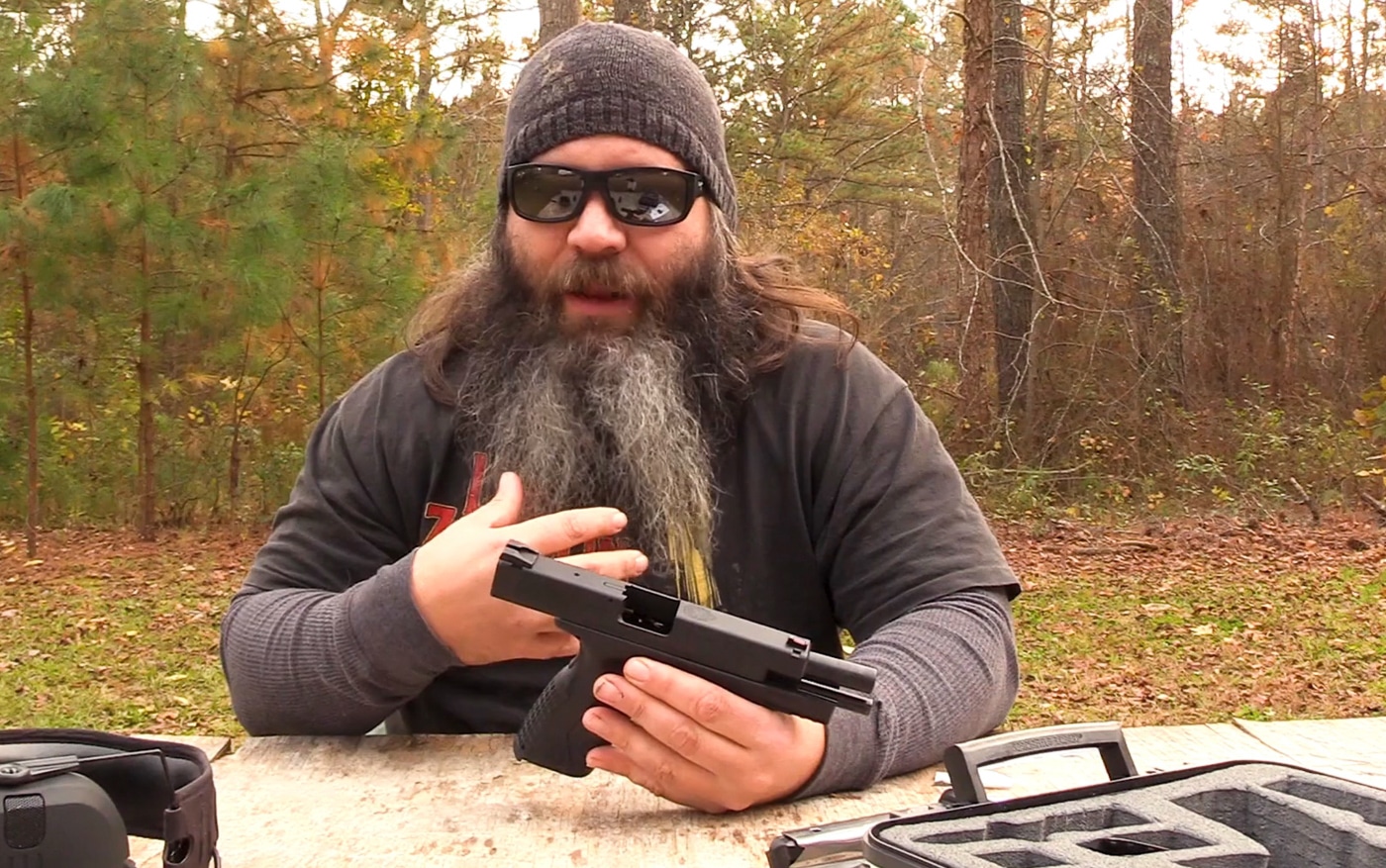 author shows the features he likes about the 10mm handgun