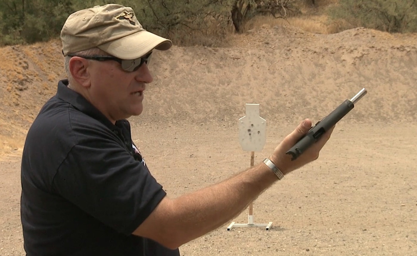A shooter's thumb presses the magazine release button on a semi-automatic handgun during reload training. Speed reload procedures require magazine ejection. Emergency reloading involves fine motor manipulation. Magazine releases enable ammunition changes. What is a speed reload includes controlled ejection. Thumb activation drops empty magazines. Shooters practice deliberate release techniques. Firearm manipulation demands consistent pressure application.