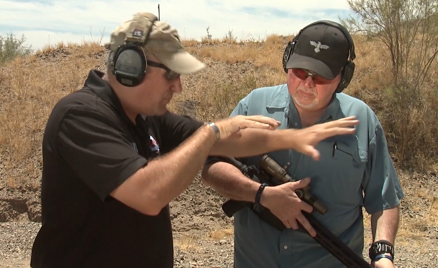 A shooter maintains tight shoulder contact with a rifle while delivering rapid center mass hits during defensive training. Non-standard response protocols address immediate threats. Rifle defensive training drills emphasize recoil control. Combat-focused shooting builds aggressive technique. Defensive rifle fundamentals prevent shot dispersion. Close-quarters rifle tactics require continuous commitment. Tactical engagement drills develop muscle memory. Fighting rifle techniques prioritize speed and accuracy. Defensive shooting training prepares for worst-case scenarios.