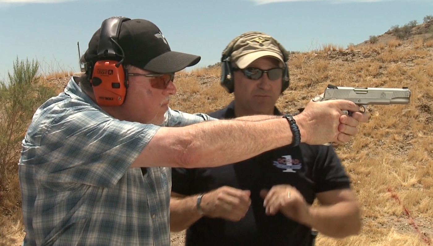 author shooting a pistol after obtaining the best sight picture possible
