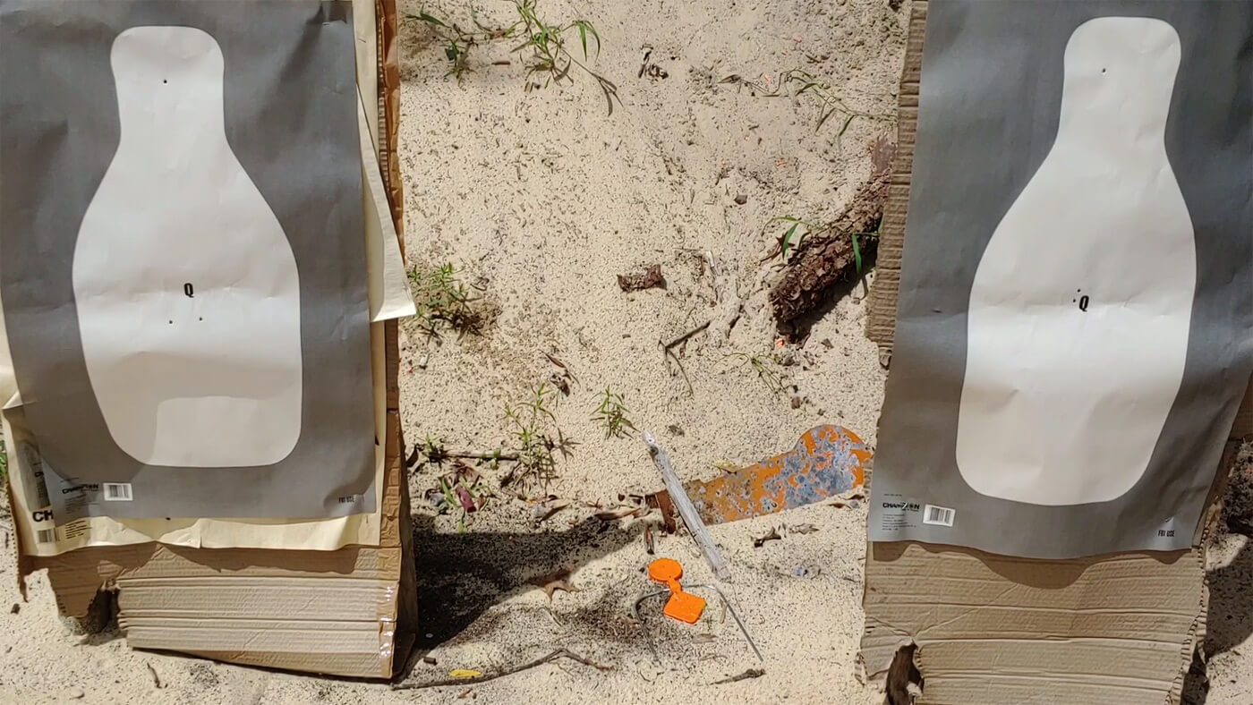 In this photo, we see two targets on a shooting range. The author used these paper targets when practicing his rifle shooting. practice movement clear self-assessment execute rear breach encounter dry-fire teammate proximity during live-fire or non-lethal engagement with impact munitions