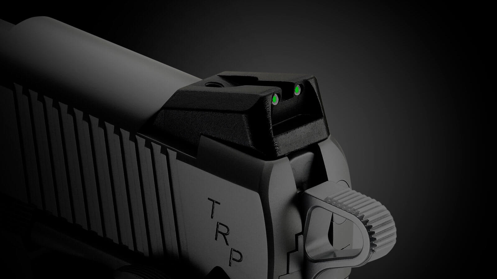 This is a photo of night sights on a Springfield Armory M1911 pistol. They can help with target acquisition and sight alignment in low light conditions. For a custom 1911, they may be standard. However, for a GI Mil-Spec pistol, night sights aren't usually included. Adding them is easier than a trigger job, replacing the hammer, upgrading the mainspring or polishing the feed ramp.