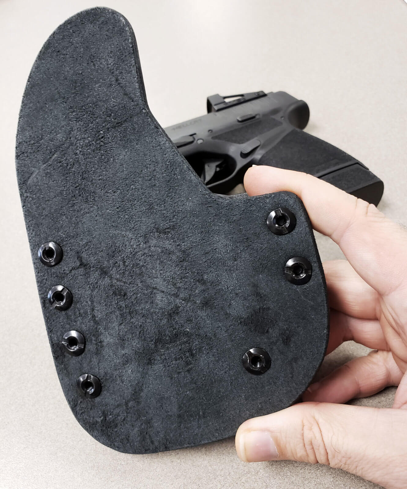 Reckoning holster examination of leather backer