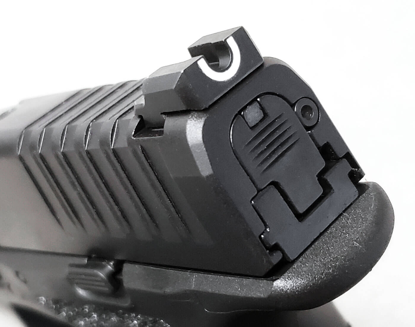 In this image, we see that the front sight visible through the u-notch rear sight even with a red dot sight installed. This is a great sights feature. Springfield Hellcat sights like the tactical rack u-dot rear sight are perfect for a personal defense weapon and home defense. Personal safety is very important when looking at Hellcat sights.