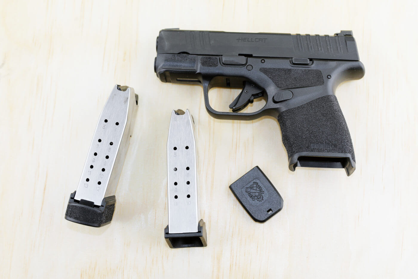 Hellcat backup gun shown with two magazines