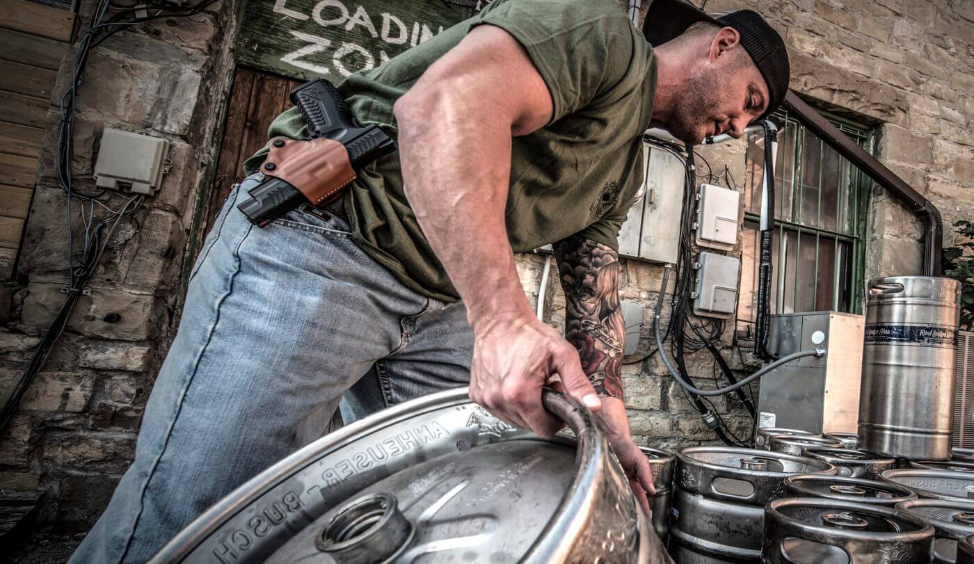 A man armed with a Springfield XD-M at work