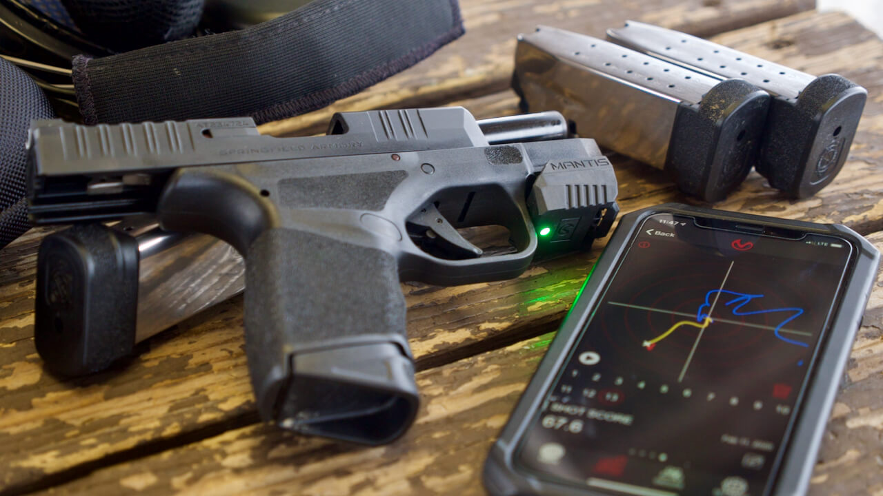 Mantis X3 shooting performance system with Springfield Armory Hellcat Shown in this photograph is the Mantis X3 shooting performance system with Springfield Armory Hellcat. The X3 is a training tool designed to help shooters improve accuracy and precision during target practice at the shooting range. It works with a variety of semi-automatic rifles, handguns, revolvers and air gun.