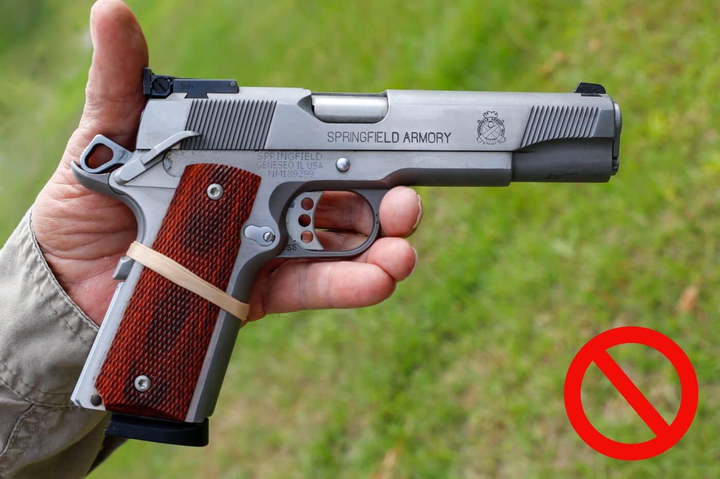In this photograph, the author illustrates the problem with deactivating the grip safety on a pistol.