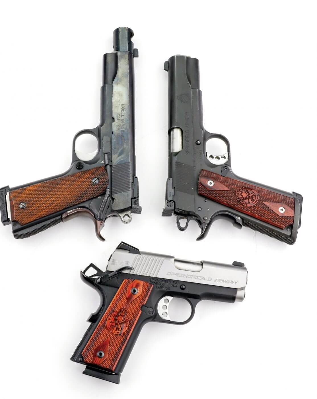 Three Springfield 1911 pistols are shown here. All are single action semi-automatic pistols that make good choices for a variety of shooting styles. Be sure to learn how to shoot a 1911 safely.