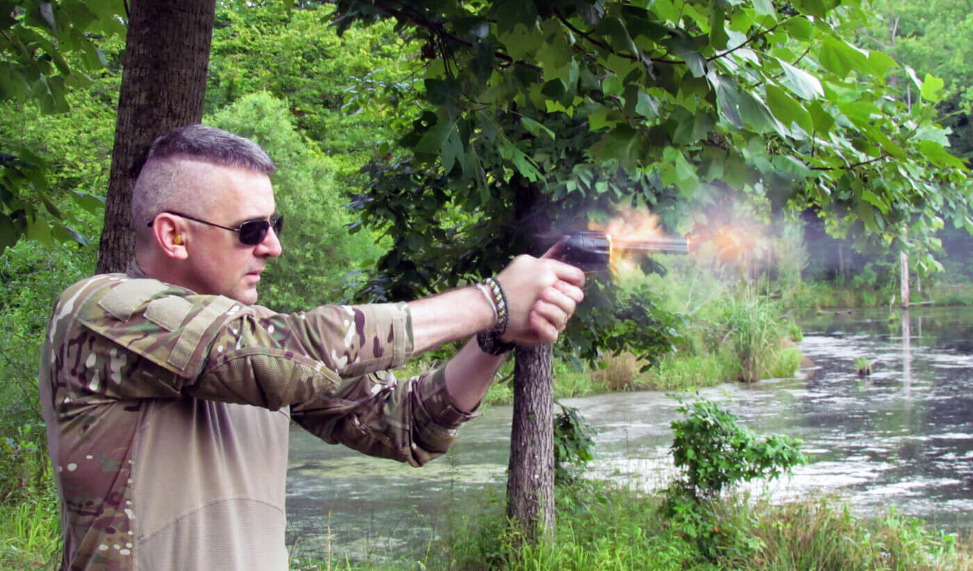 author shooting a revolver