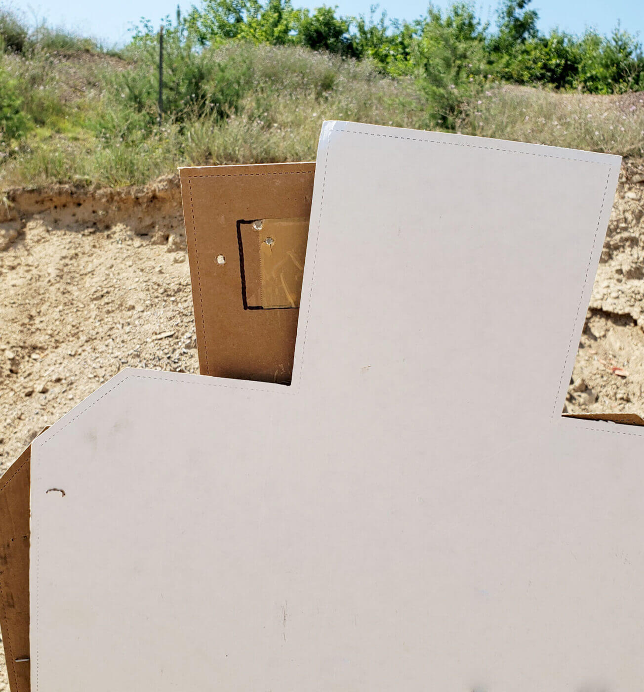 This image of hostage and hostage taker targets helps to set up a 36 yard zero. One must first safely secure their firearm in a stable rest or shooting bench. Then aim directly at a target placed exactly 36 yards away. Fire several rounds, then adjust the sight based on where your shots are grouping until they are hitting precisely where you are aiming.