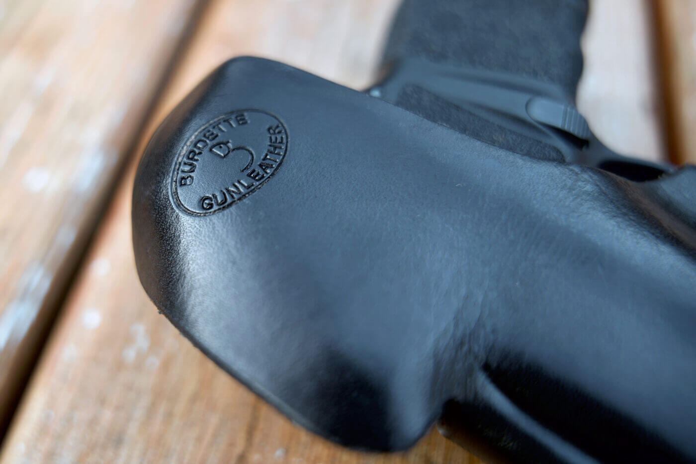 Detail shot of maker mark on leather holster