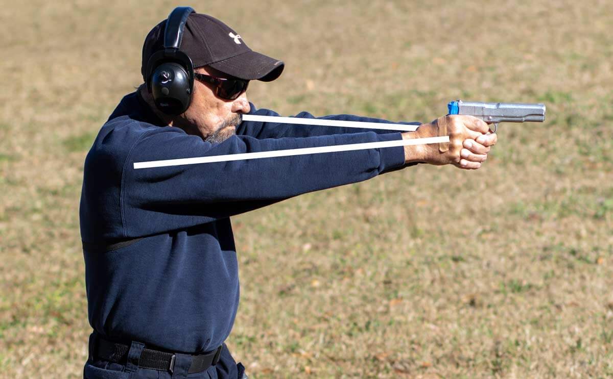 Isosceles shooting stance demonstrated from the side