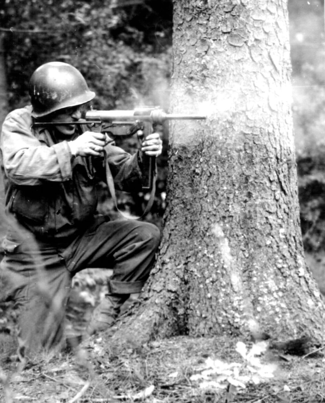 Soldier shooting M3 SMG in World War II