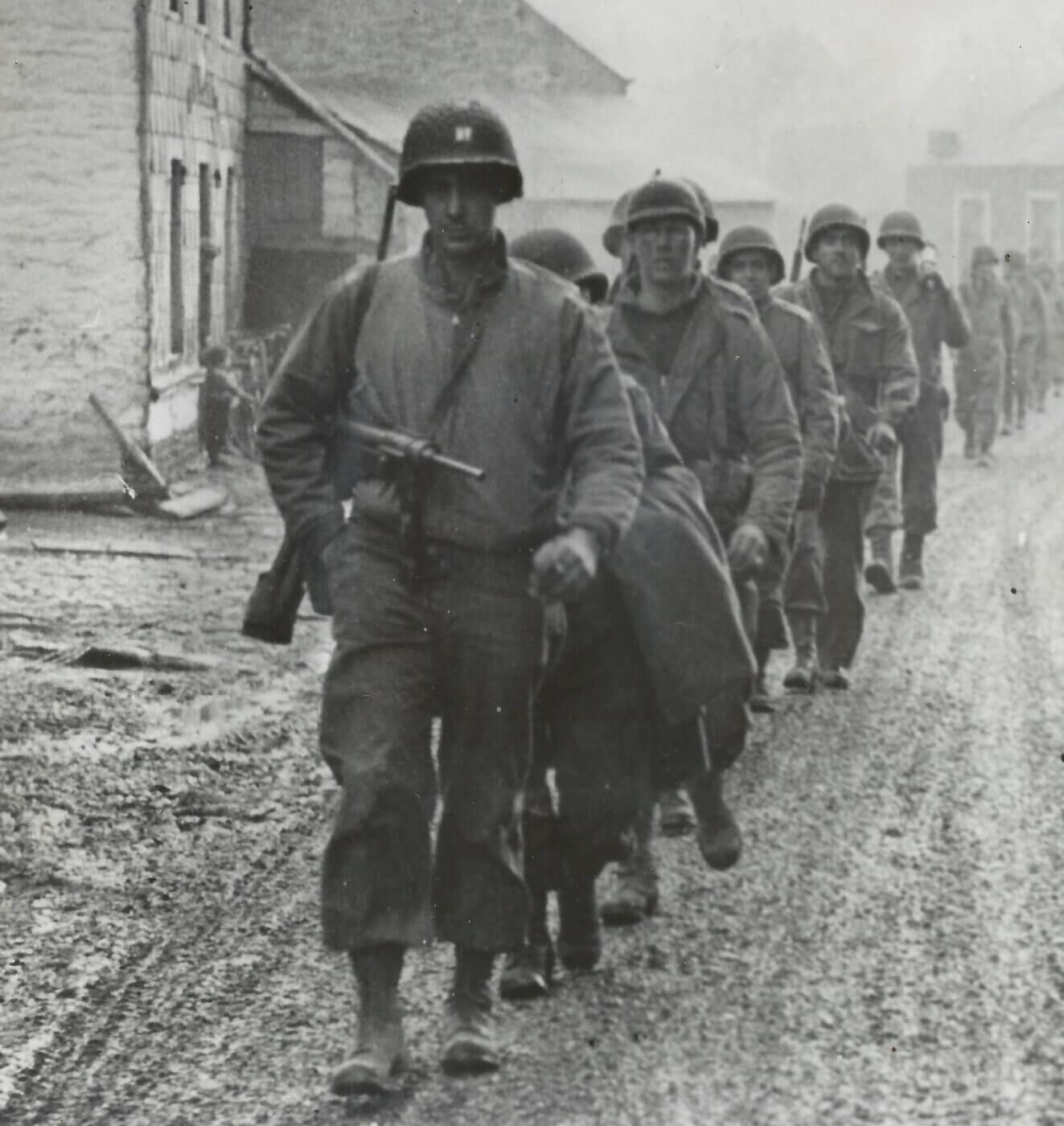 The Battle of the Bulge: M3 SMG leading the march out of St. Vith. Image: NARA