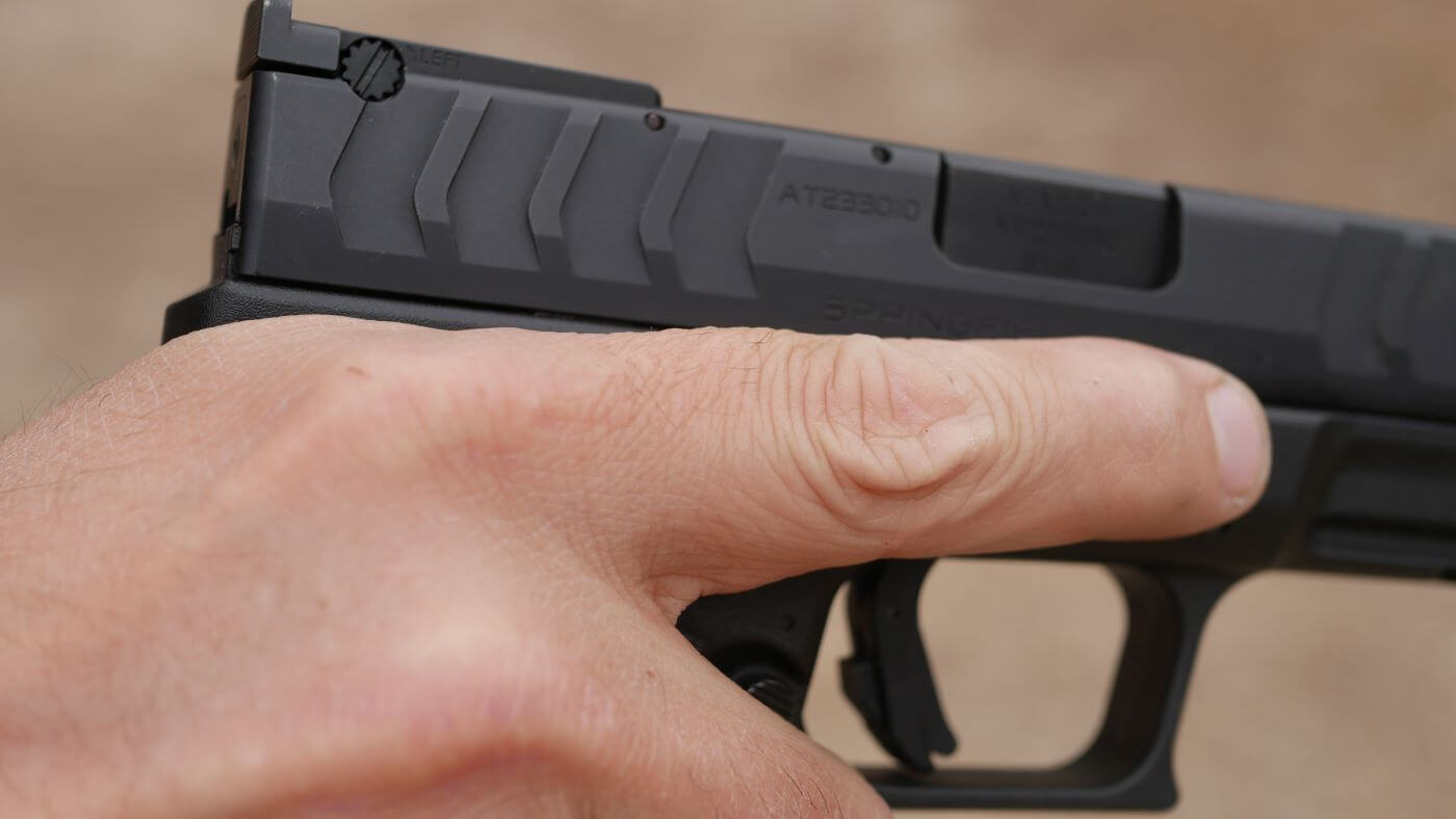 High hold grip of pistol for recoil control