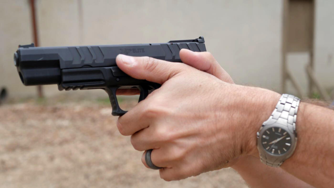 Correct two-handed pistol grip for recoil control