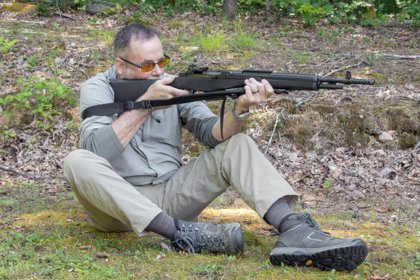 Shooting a rifle while sitting