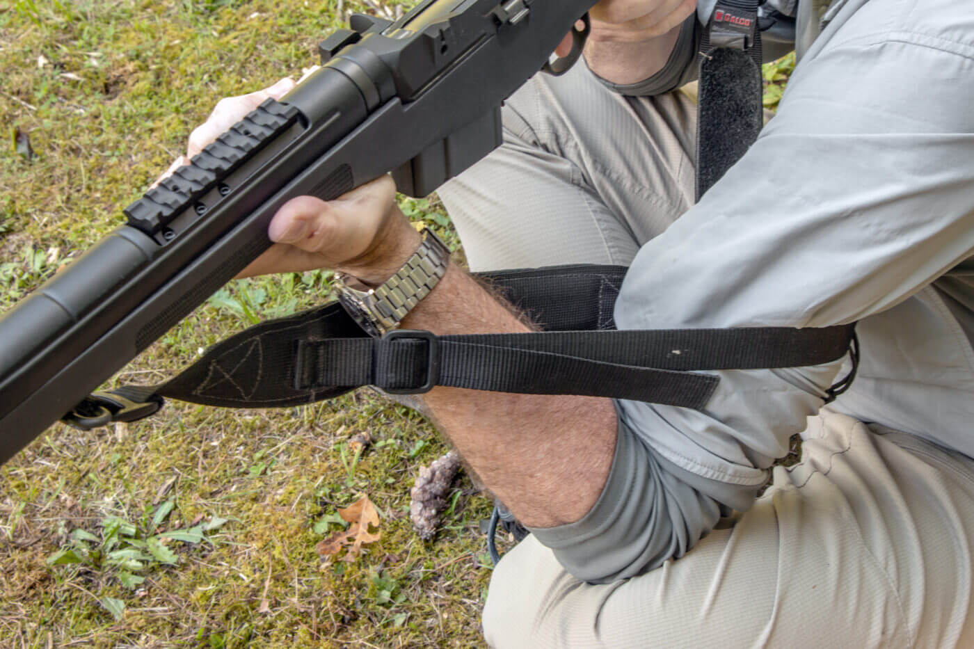 Using a sling while shooting from a sitting position