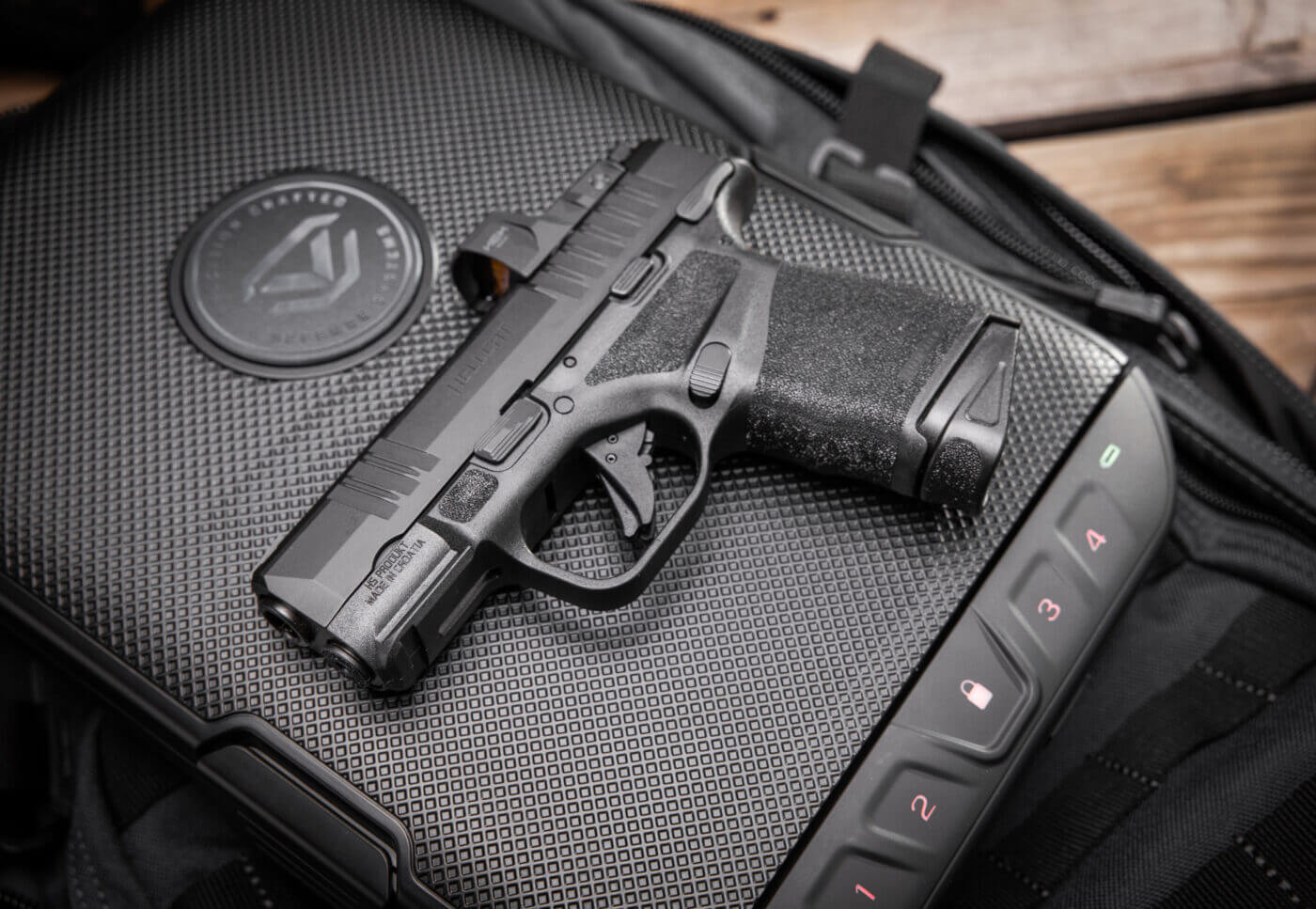 Black Springfield Hellcat handgun on top of Vaultek LifePod 2.0 lock box