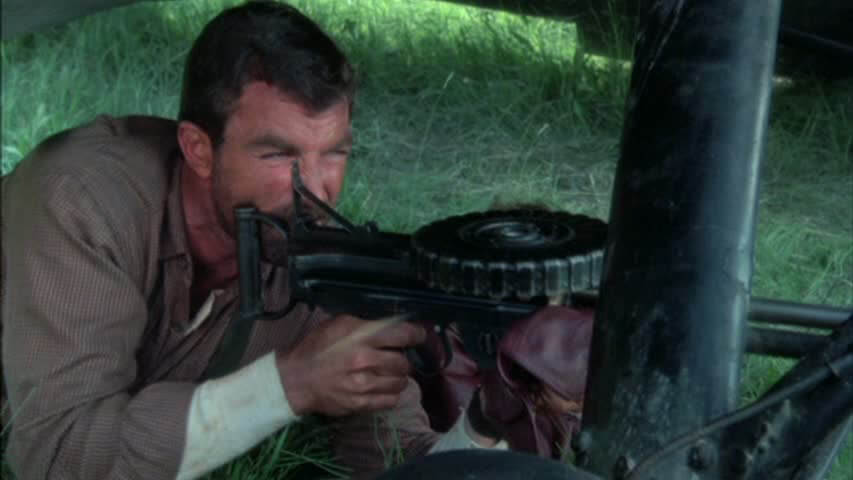 Tom Selleck fires a Lewis Gun