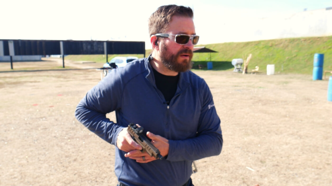 Man competition shooting with his duty gun