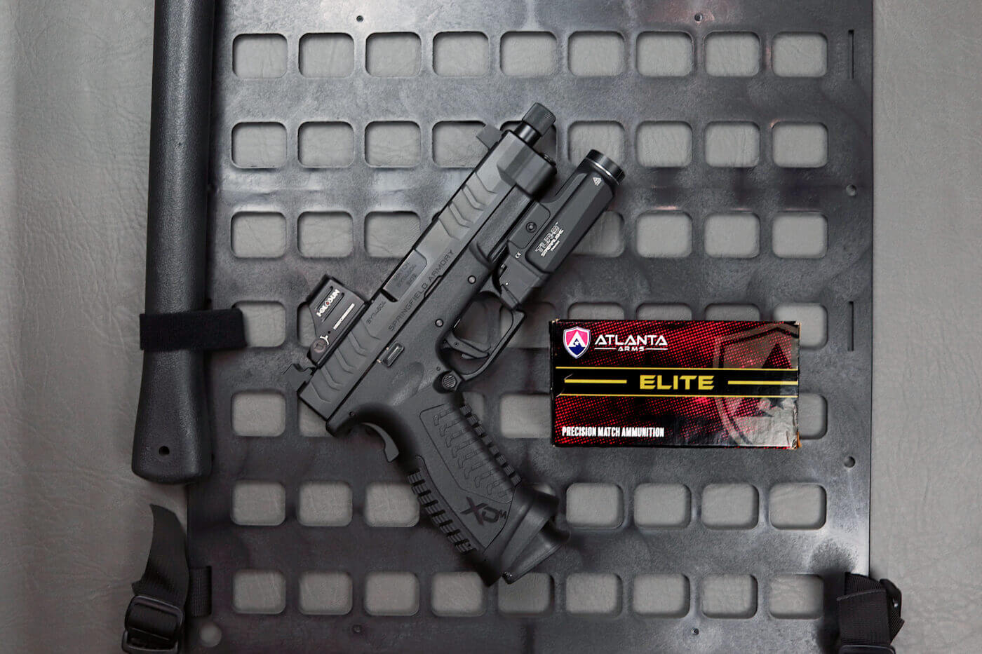 Streamlight TLR-9 on a pistol next to Atlanta Arms ammo