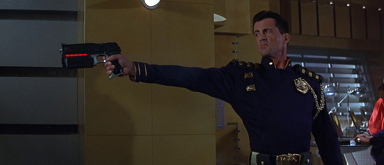 Stalone with Lawgiver pistol in Judge Dredd