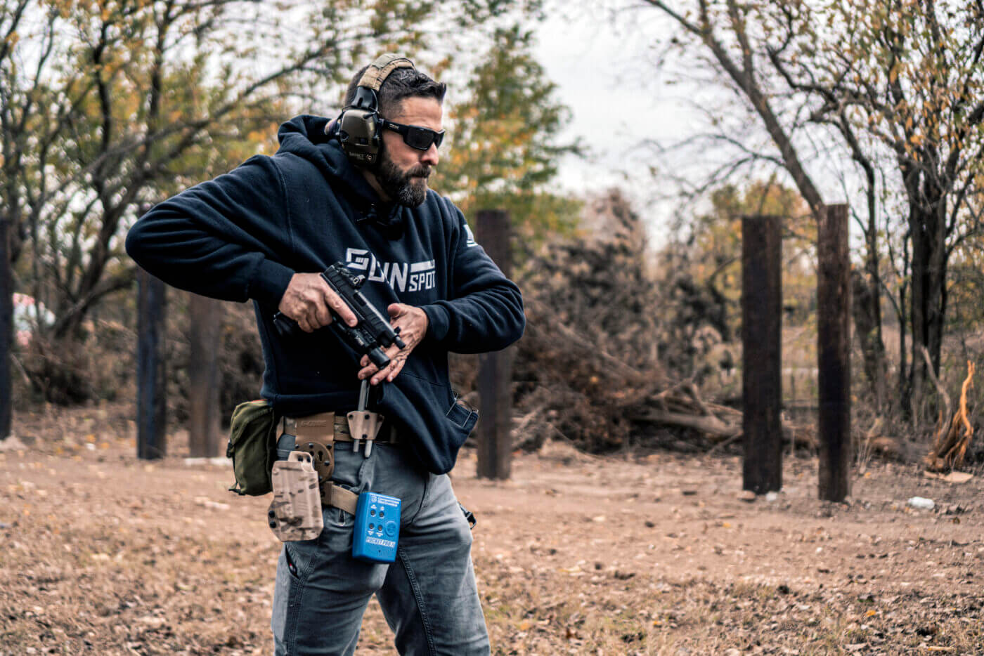 Man drawing pistol during Phase 5 drill