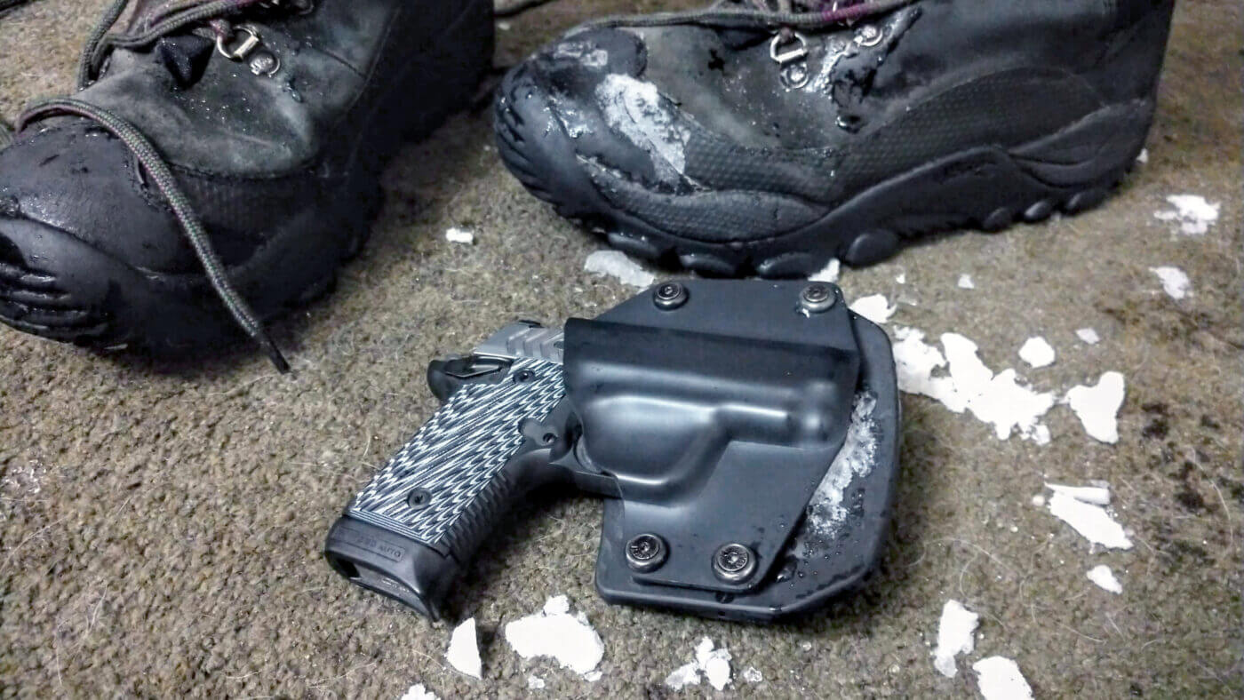 Springfield Armory pistol on floor with snow