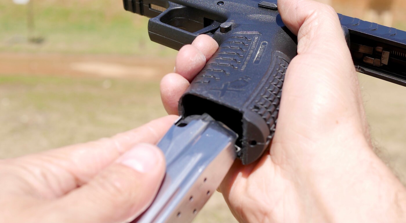 Using pointer finger during pistol reload