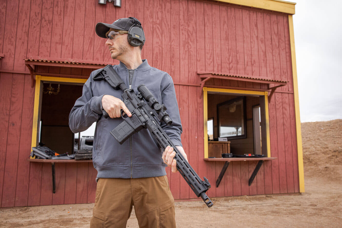 Man holding AR-15 rifle in .308 Win