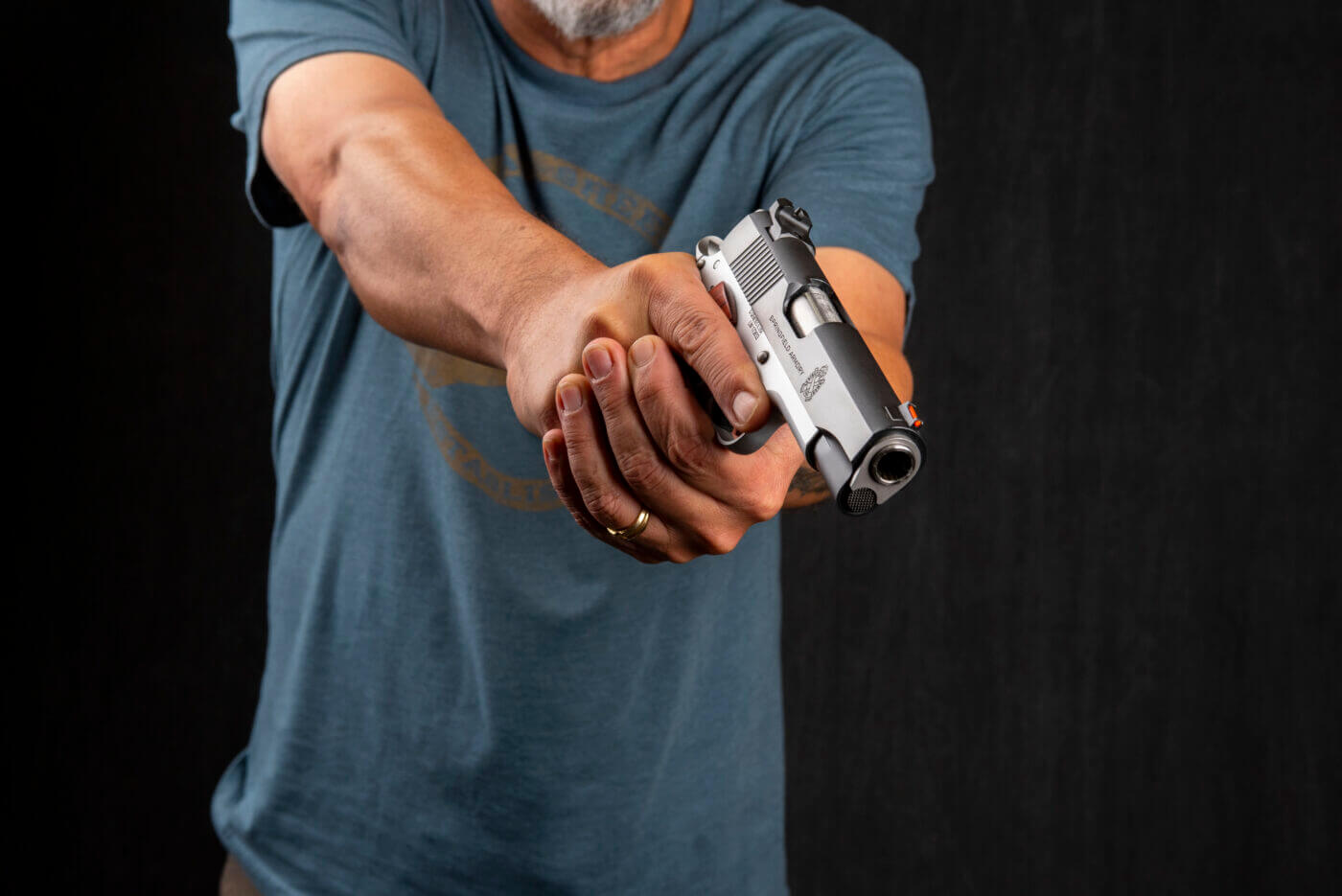 Man with Springfield 1911 pistol