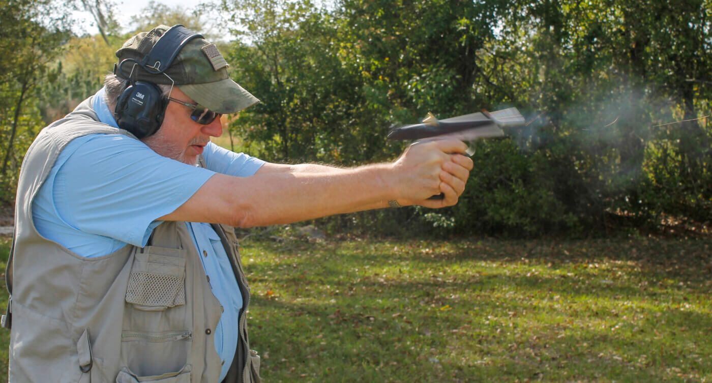 Man shooting a 1911 pistol