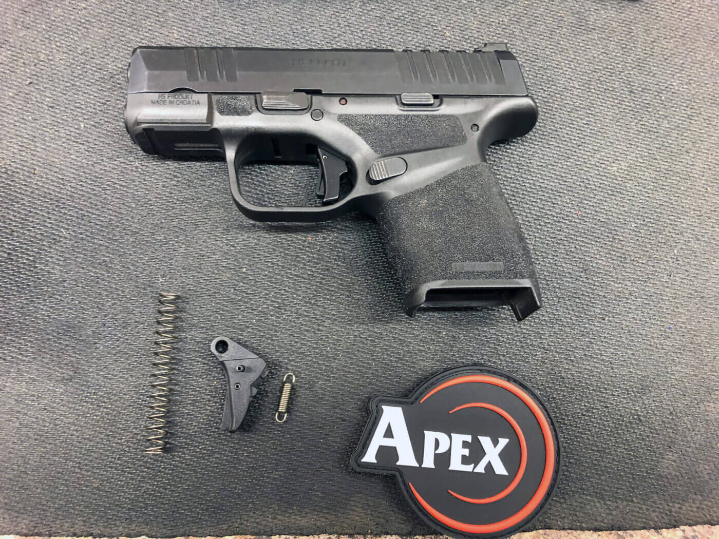 A trigger upgrade for the Hellcat pistol may be an acceptable gun modification. Pistol modifications that improve safety of a firearm or otherwise maintain the factory specifications, the more likely your modified pistol will be ok in a legal proceeding.