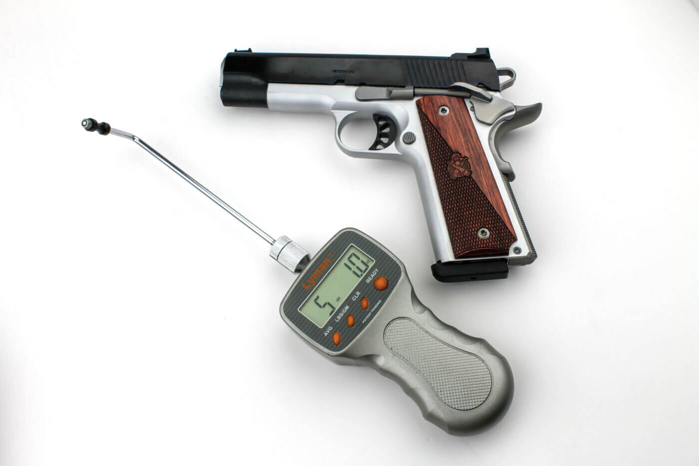 Pistol with trigger pull weight measuring devices