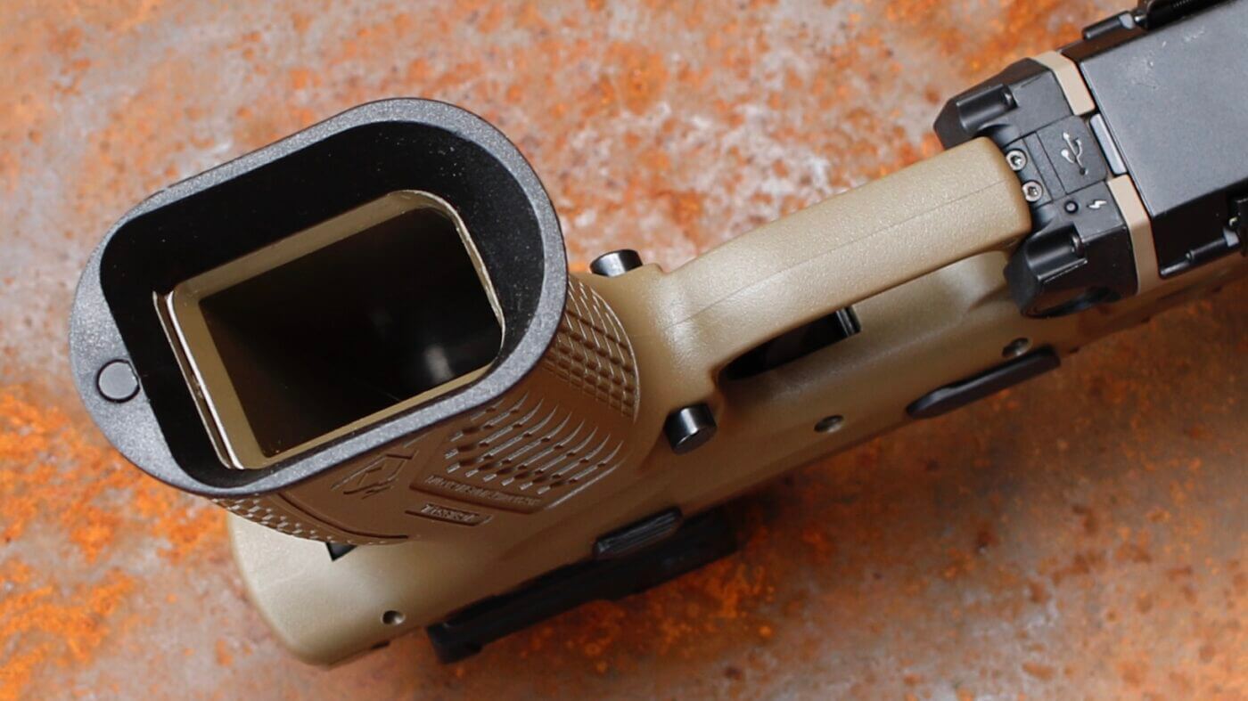 Flared mag well on XD-M pistol