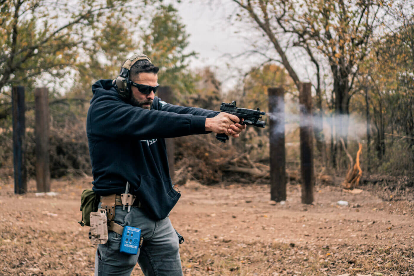 Man shooting a Springfield XD-M Elite Tactical OSP