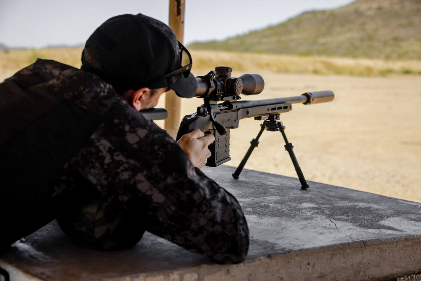 Shooting rifle at precision rifle training