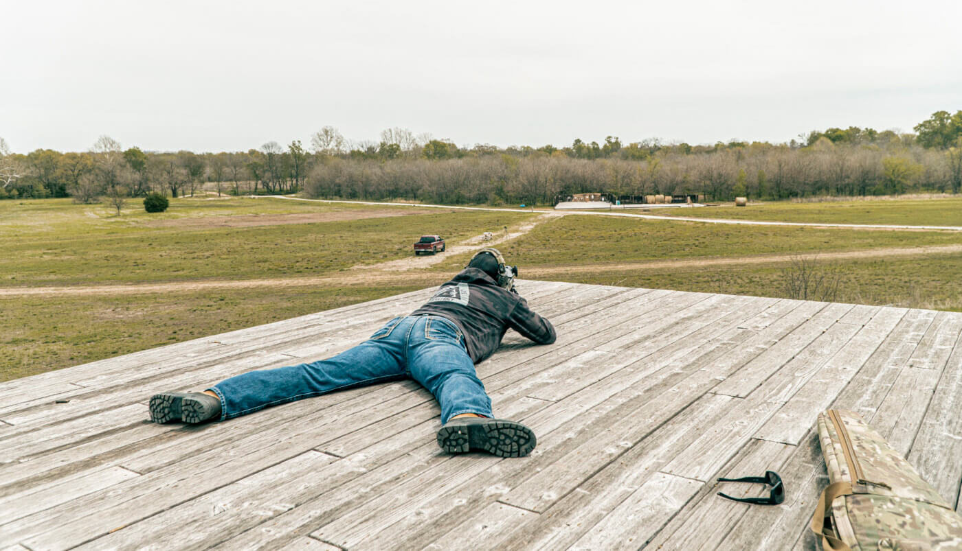 Man shooting long range with natural alignment to target