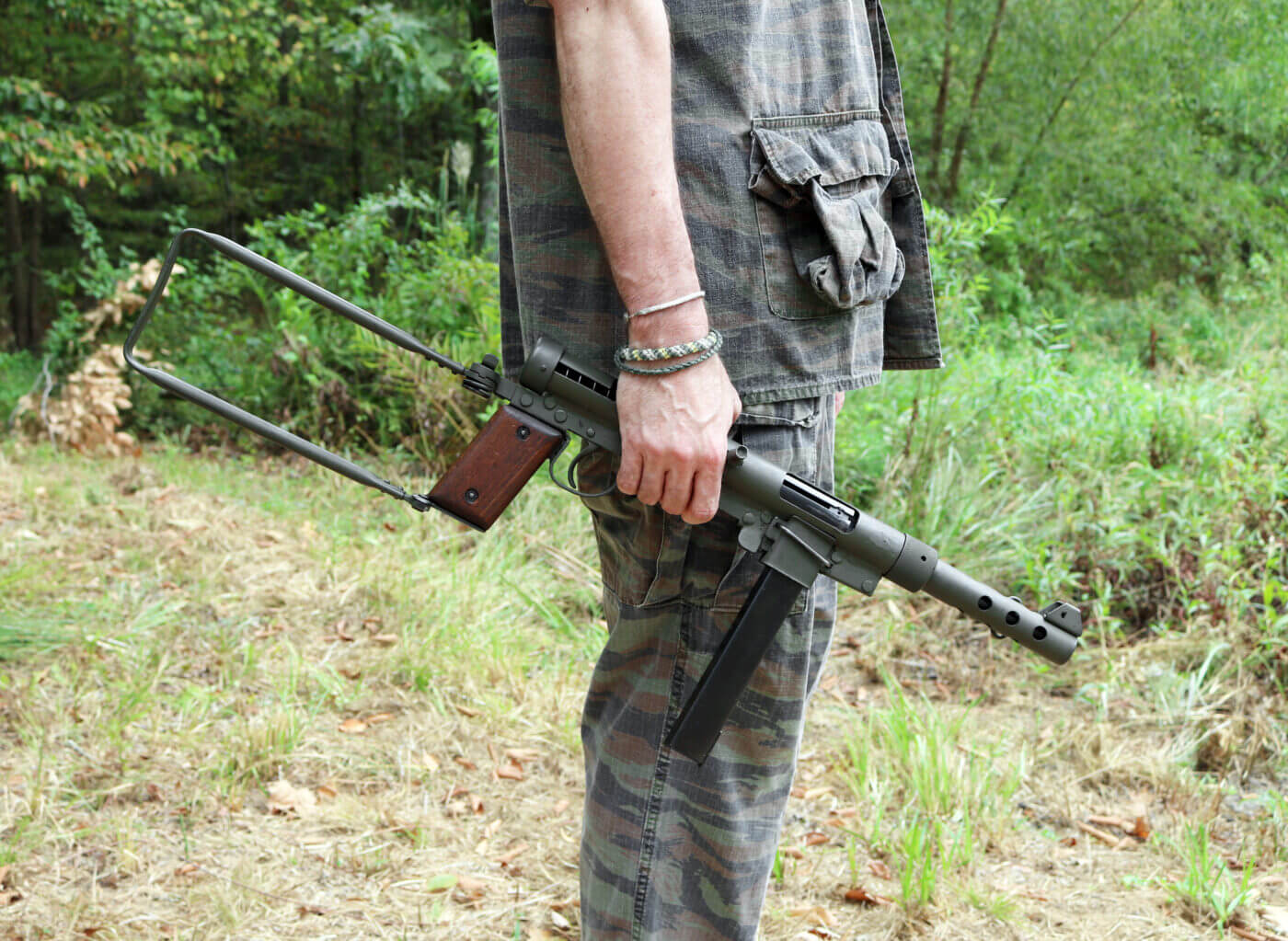 Man holding Swedish K submachine gun