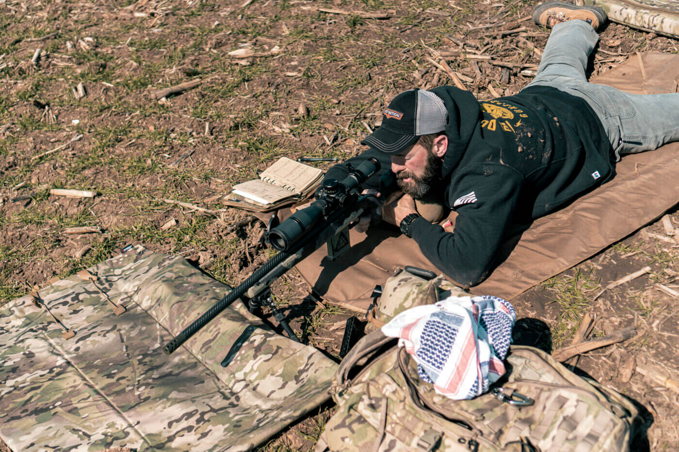 Man shooting rifle long range