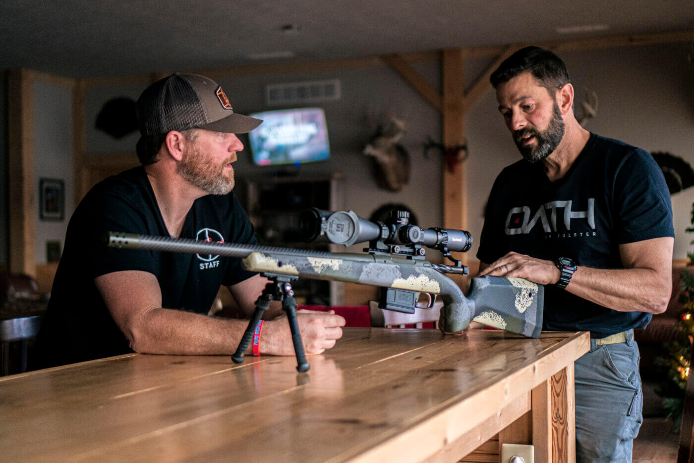 Men standing and talking about Springfield Armory Model 2020 Waypoint rifle