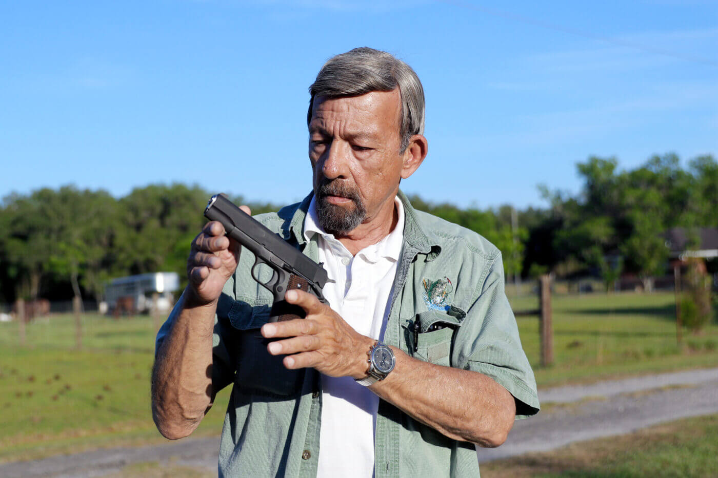 Massad Ayoob holding the Springfield Armory 1911 Mil-Spec pistol